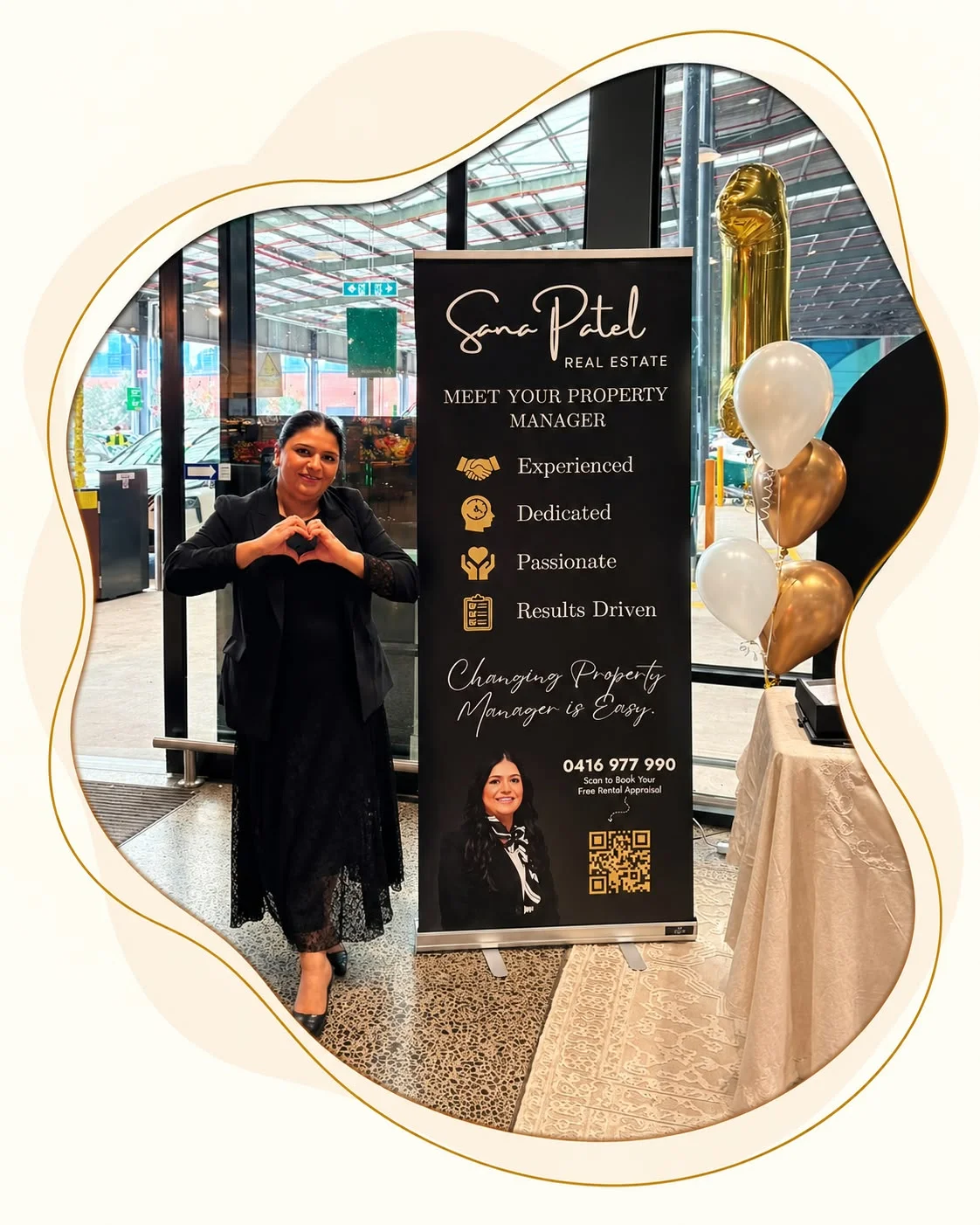 Sana Patel beside her property management display at a community event