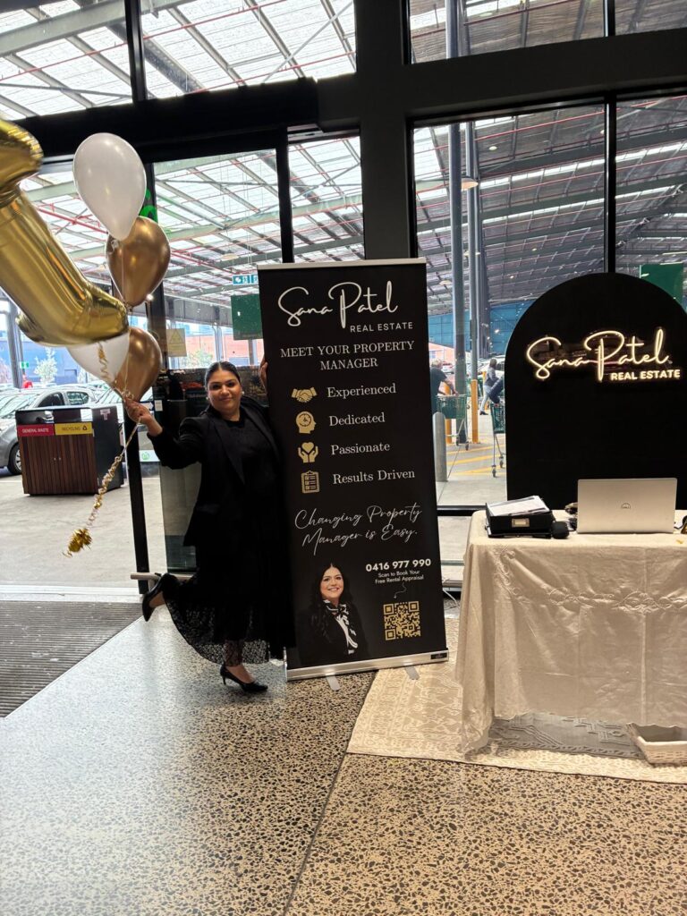 Sana Patel at the Sana Patel Real Estate community display